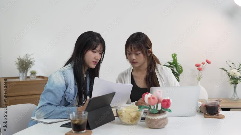 Students studying and brainstorming campus concept. Close up of students discussing their subject on books textbooks and writing to notebook. Students studying and brainstorming campus concept. Close up of students discussing their subject on books textbooks and writing to notebook.