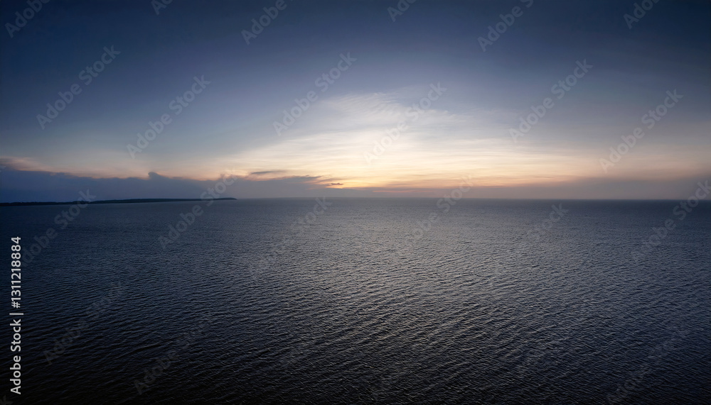 Serene Coastal Horizon: The vast ocean expanse under a captivating evening sky, creating a mesmerizing gradient of blues, capturing tranquility and natural beauty. Serene Coastal Horizon: The vast ocean expanse under a captivating evening sky, creating a mesmerizing gradient of blues, capturing tranquility and natural beauty.