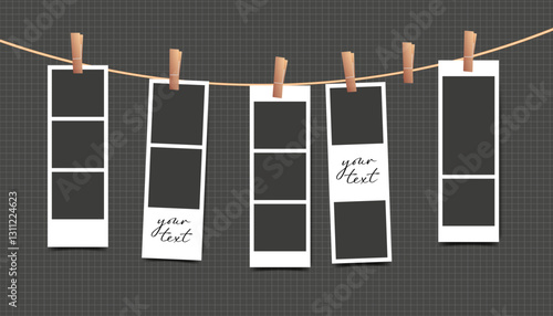 Blank photo booth stripe frame of set hanging on rope on black background