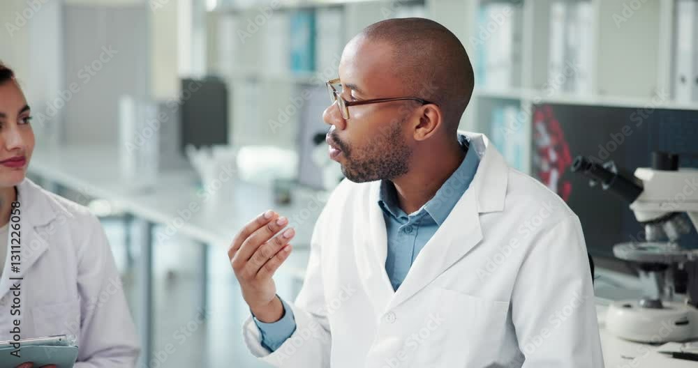 Scientist, team and man discussion in lab, research and review for progress, drugs and pharmaceutical company. People, talking and speaker with info for medical project with vaccine development Scientist, team and man discussion in lab, research and review for progress, drugs and pharmaceutical company. People, talking and speaker with info for medical project with vaccine development