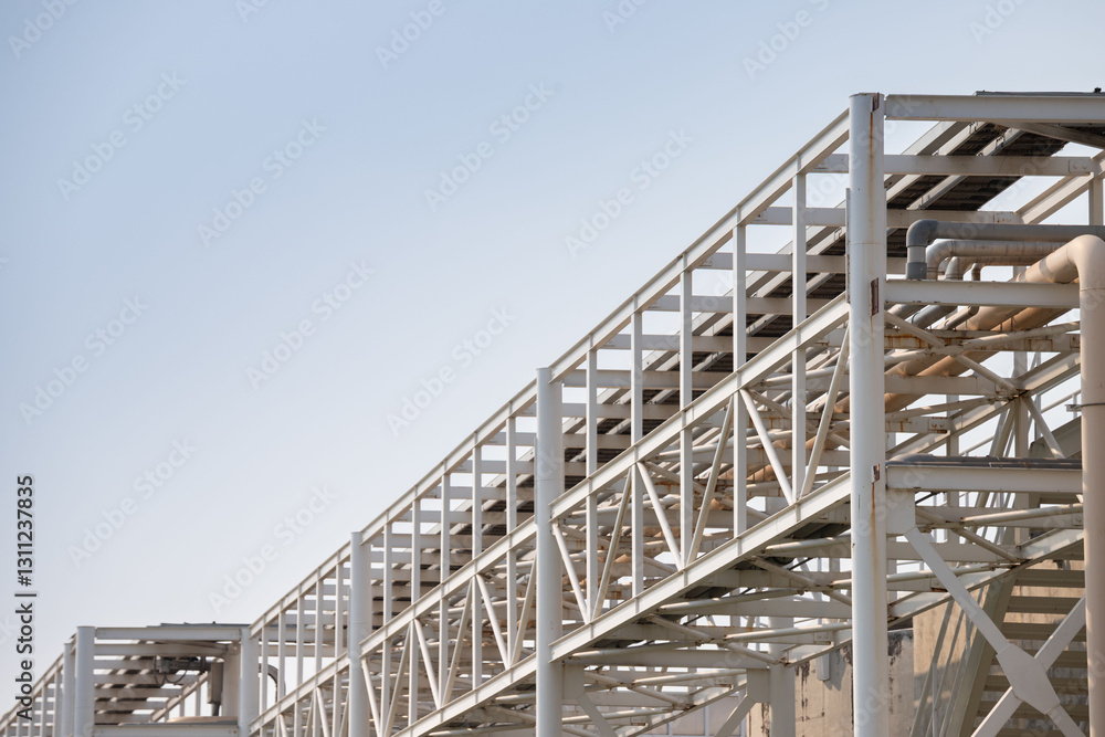 Fototapeta premium A large white structure with a lot of metal pipes and wires