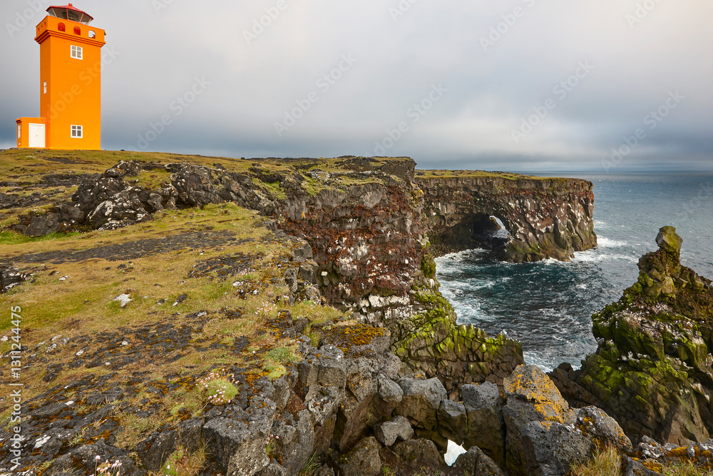Picturesque Krossnes orange lighthouse in Snaefellnes Peninsula coastline. Iceland