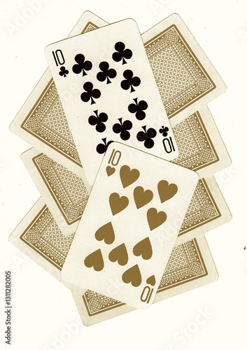 Photography A montage of playing card backs with a pair of tens revealed in sepia