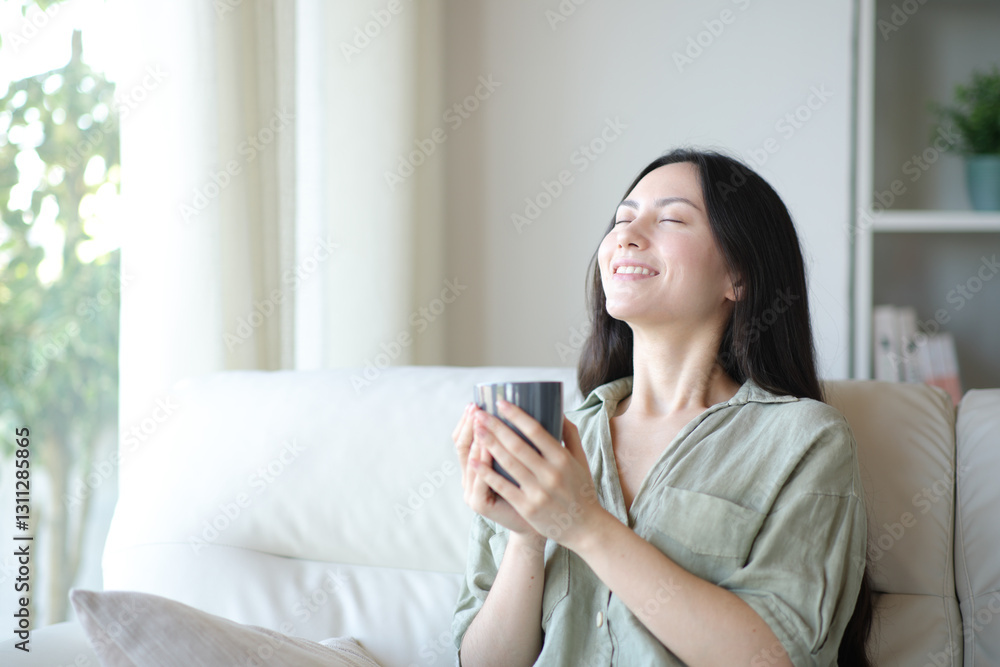 Asian woman breathing fresh air at home drinking coffee Asian woman breathing fresh air at home drinking coffee