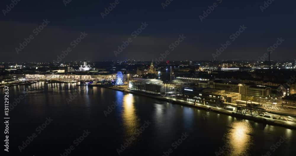 Hyperlapse drone shot of the illuminated Helsinki south harbor, night in Finland Hyperlapse drone shot of the illuminated Helsinki south harbor, night in Finland