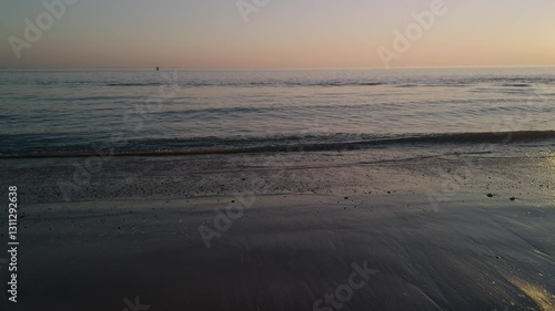 Wallpaper Mural view of sunset from the beach seashore to the North sea ocean in Europe with water waves and sunlight in the evening Torontodigital.ca