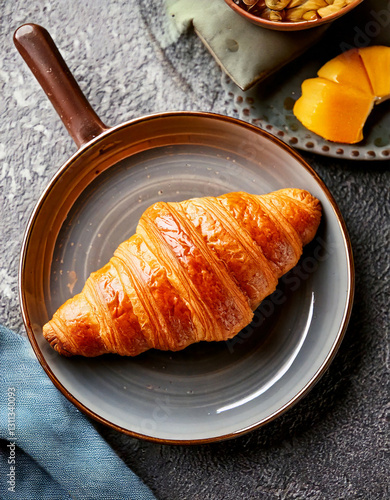 Obraz na płótnie Croissant on plate top view fresh pastry social media style w salonie