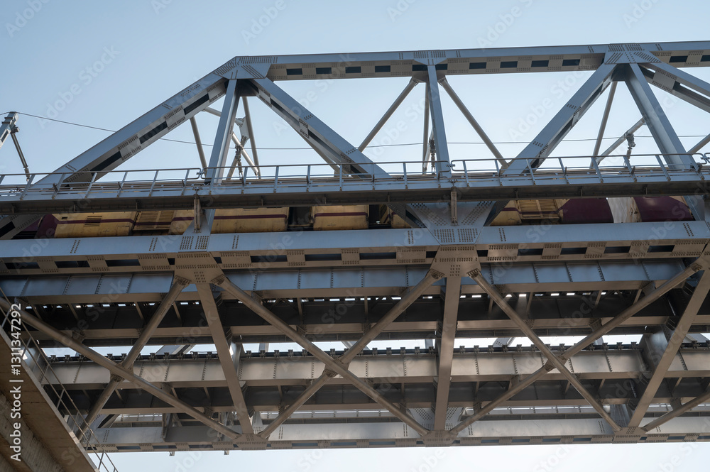 Prayagraj,India-28 pJanuary 2025 View of the steel bridge on which the train is going at the Kumbh Mela in Prayagraj or Allahabad Uttar Pradesh India Prayagraj,India-28 pJanuary 2025 View of the steel bridge on which the train is going at the Kumbh Mela in Prayagraj or Allahabad Uttar Pradesh India