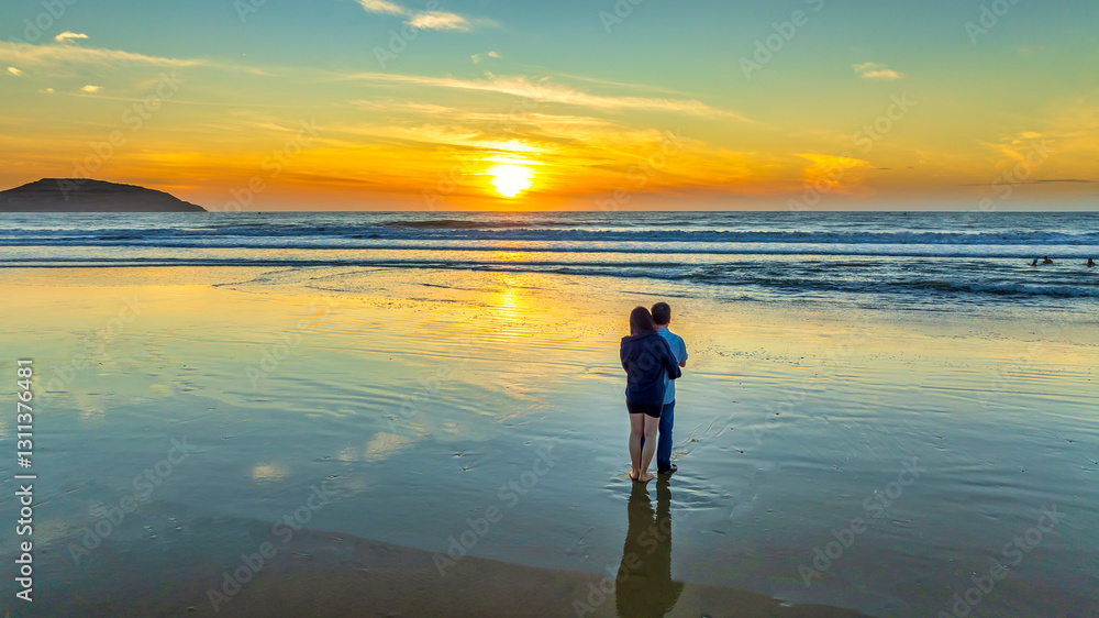 Silhouette of a Couple love toghether on beach at sunset, Vietnam