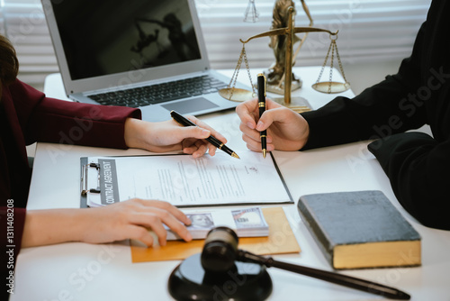 Professional lawyers consult with clients in the office on legal agreements, contracts and financial matters to ensure fairness and compliance with the law.