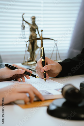 Professional lawyers consult with clients in the office on legal agreements, contracts and financial matters to ensure fairness and compliance with the law.