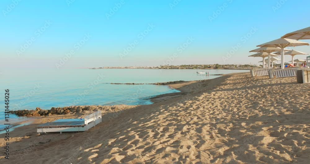 Sandy coast of Hurghada at sunset in Egypt. Panning Sandy coast of Hurghada at sunset in Egypt. Panning