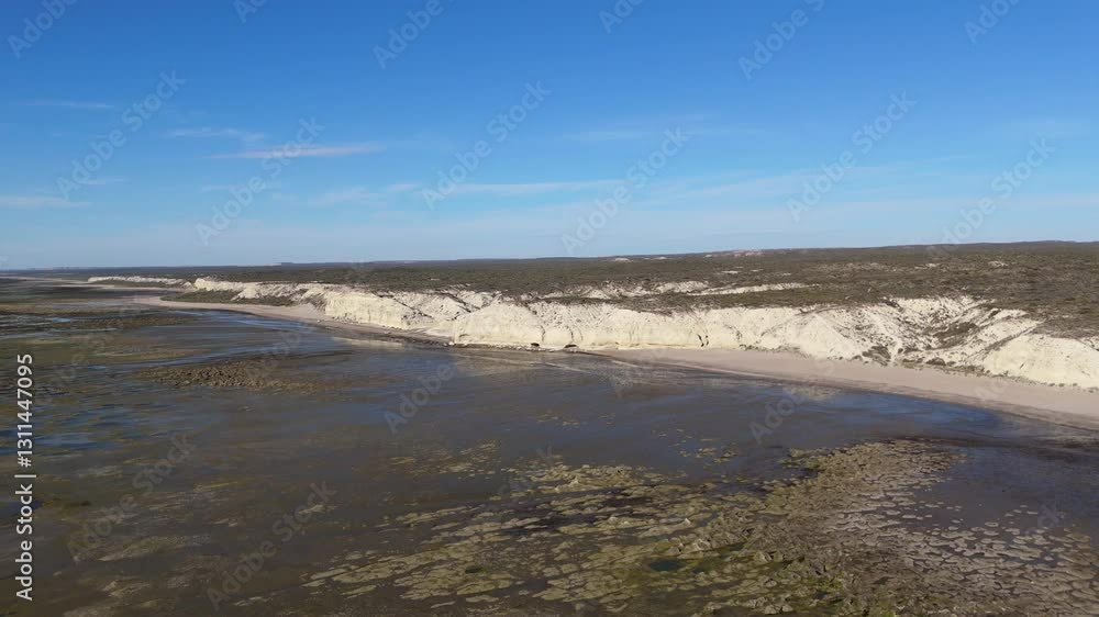 custom made wallpaper toronto digitalAerial footage of El Cañadón de las Ostras, a beautiful coastal area in Las Grutas, Argentina, showcasing dramatic cliffs and serene beach views.