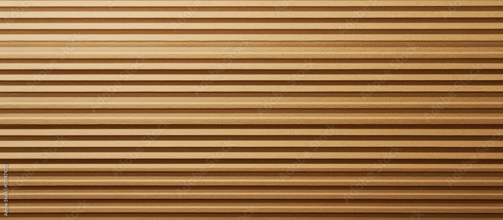 Textured brown cardboard background with horizontal stripes in varying shades creating depth and visual interest for design applications. Textured brown cardboard background with horizontal stripes in varying shades creating depth and visual interest for design applications.