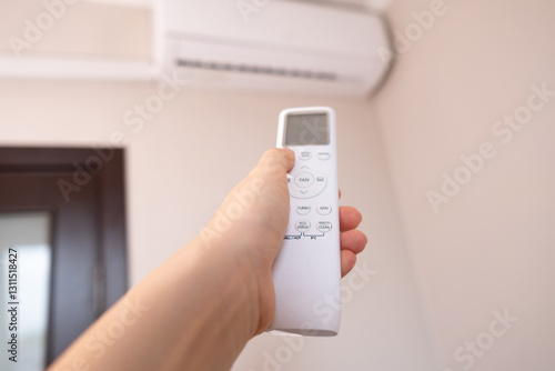 Foto Woman controls smart home with a remote, creating a comfortable atmosphere in her home