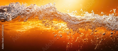 Vibrant orange waves with bubbles and froth rise diagonally across a golden backdrop showcasing the beauty of underwater ecosystems.