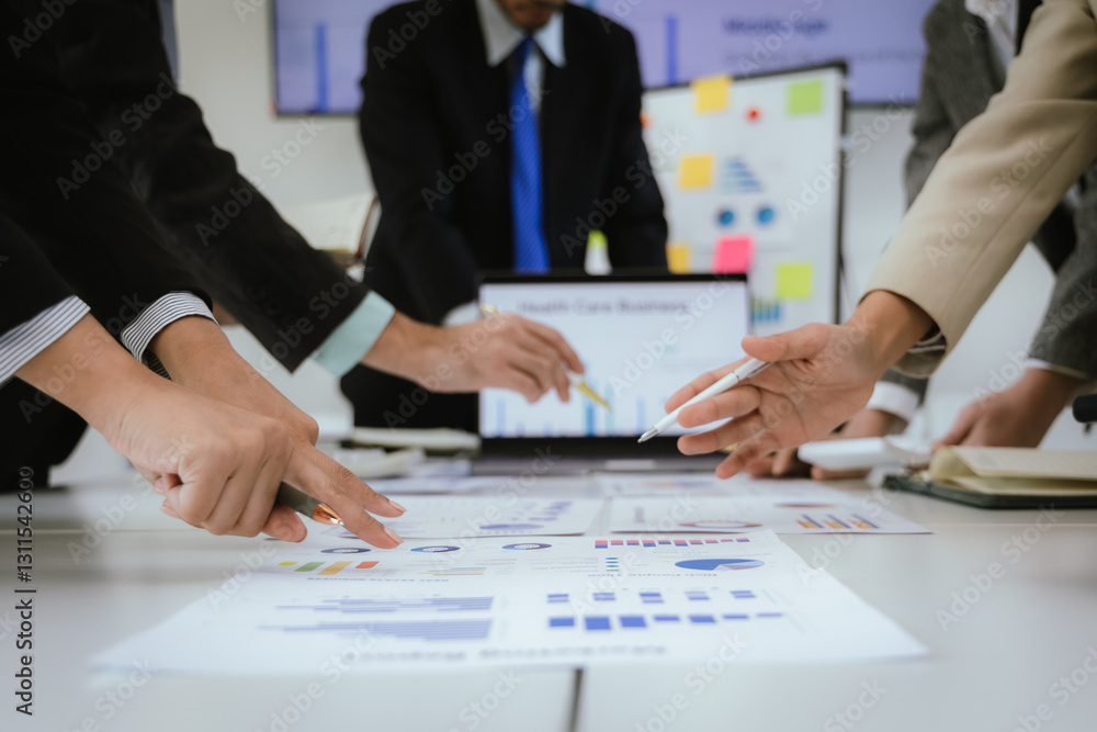 Business teams meet to discuss finances, analyze reports, charts and investment plans. Executives collaborate to plan strategies, budgets and growth, using technology and teamwork to drive business su Business teams meet to discuss finances, analyze reports, charts and investment plans. Executives collaborate to plan strategies, budgets and growth, using technology and teamwork to drive business su