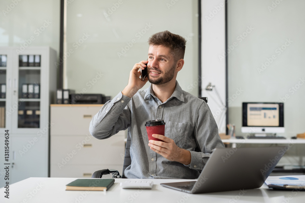 Fototapeta premium Male businessman talk mobile phones update tasks with milestones progress planning while working on laptop computers.