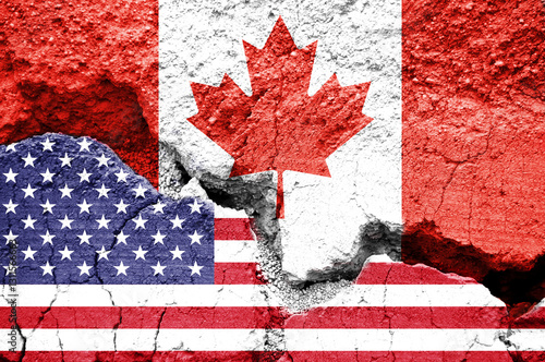 Foto US American and Canadian flags on cracked background