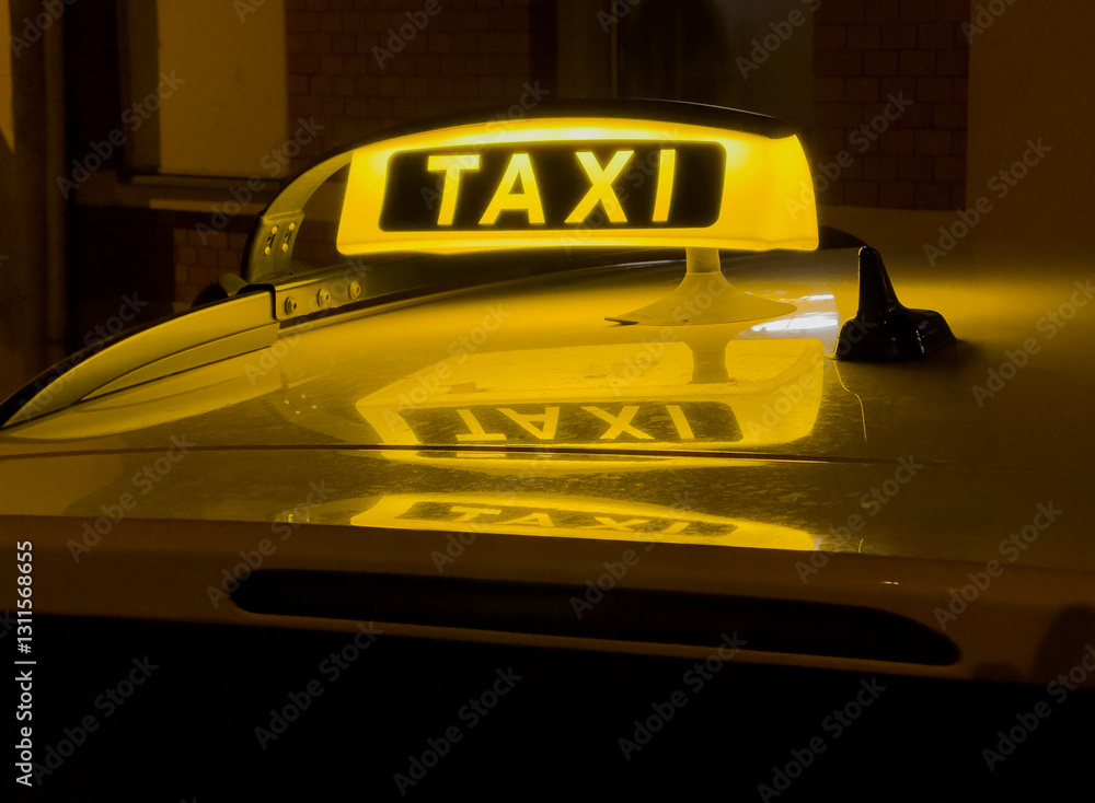 taxi sign on the street in germany at night
