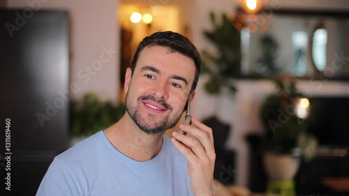 Man responding a voice call on a vintage flip-phone 