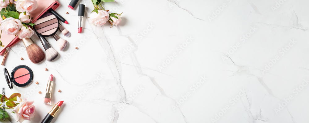 Make up products at white marble background.