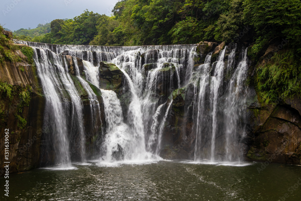Fototapeta premium Shifen Waterfall - Famous nature landscape of Taiwan, shot in Pingxi District, New Taipei, Taiwan.