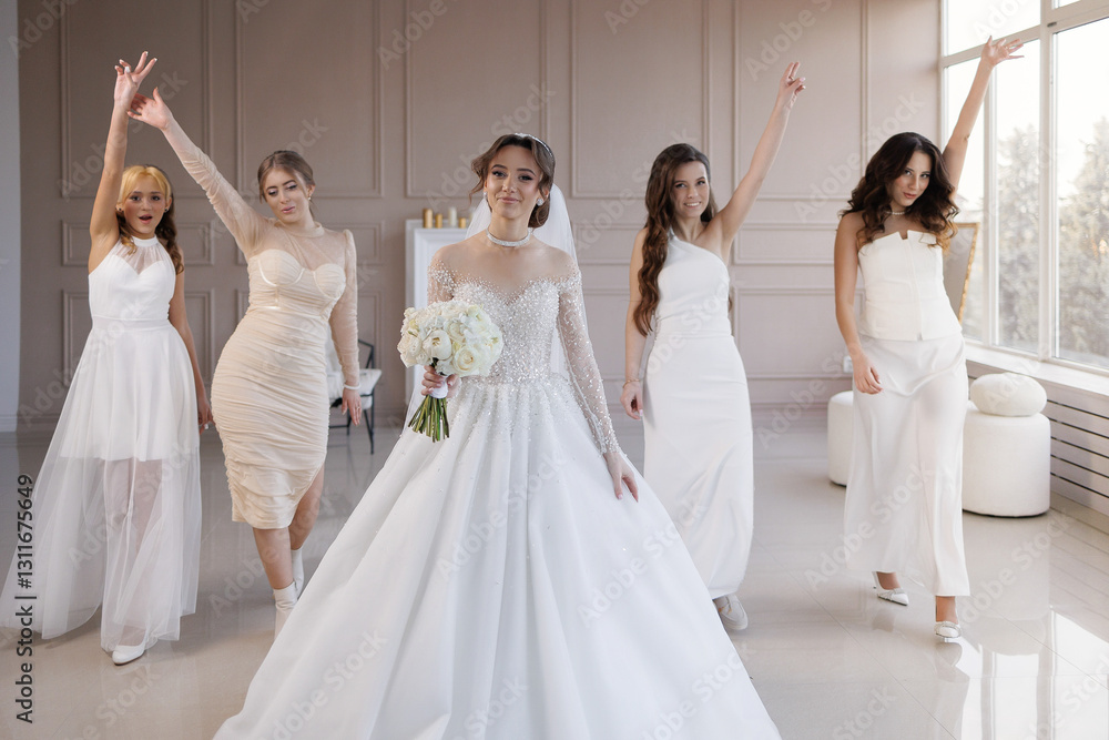 A group of women are posing for a picture in front of a bride. The bride is wearing a white dress and holding a bouquet. The other women are dressed in white and are standing around her A group of women are posing for a picture in front of a bride. The bride is wearing a white dress and holding a bouquet. The other women are dressed in white and are standing around her