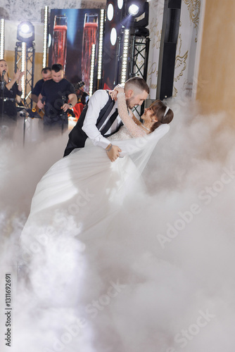 Wallpaper Mural A bride and groom are dancing in the air in front of a foggy background. Scene is romantic and joyful Torontodigital.ca