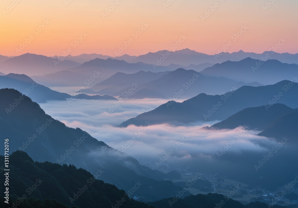 Fototapeta premium Majestic mountain layers at sunrise with serene foggy valleys and vibrant horizon