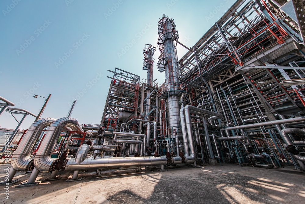 Fototapeta premium Oil​ refinery​ and​ plant and tower column of Petrochemistry industry Refinery plant equipment for pump pipeline oil and gas valves
