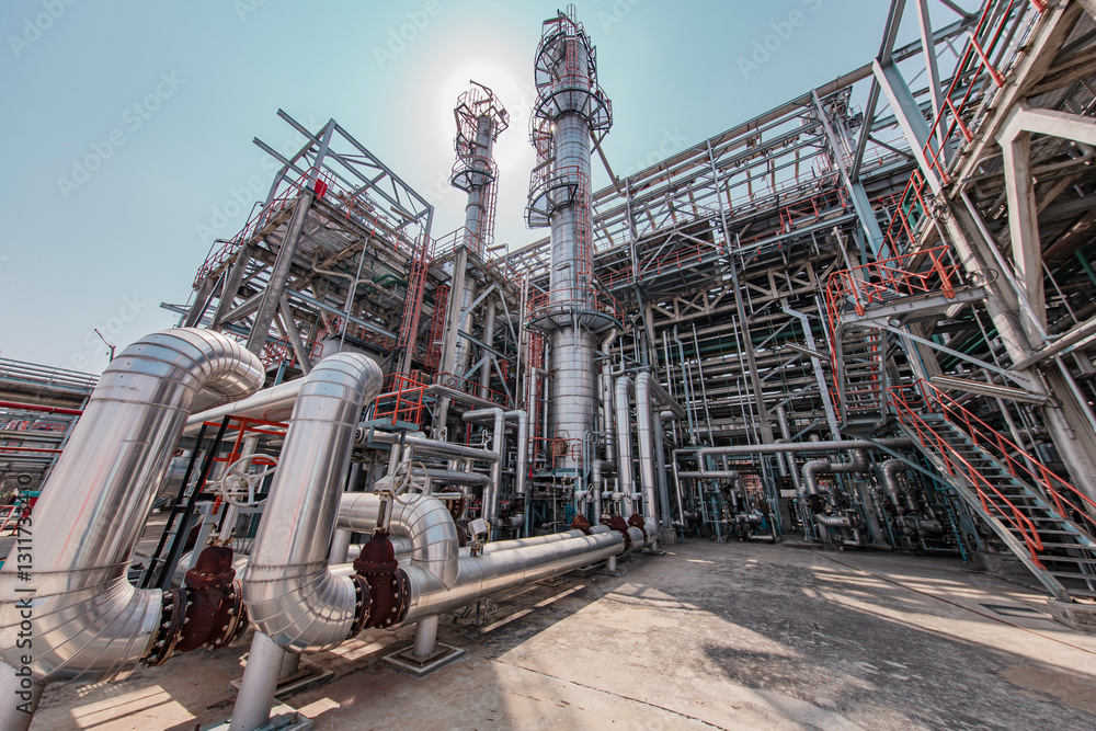 Fototapeta premium Oil​ refinery​ and​ plant and tower column of Petrochemistry industry Refinery plant equipment for pump pipeline oil and gas valves