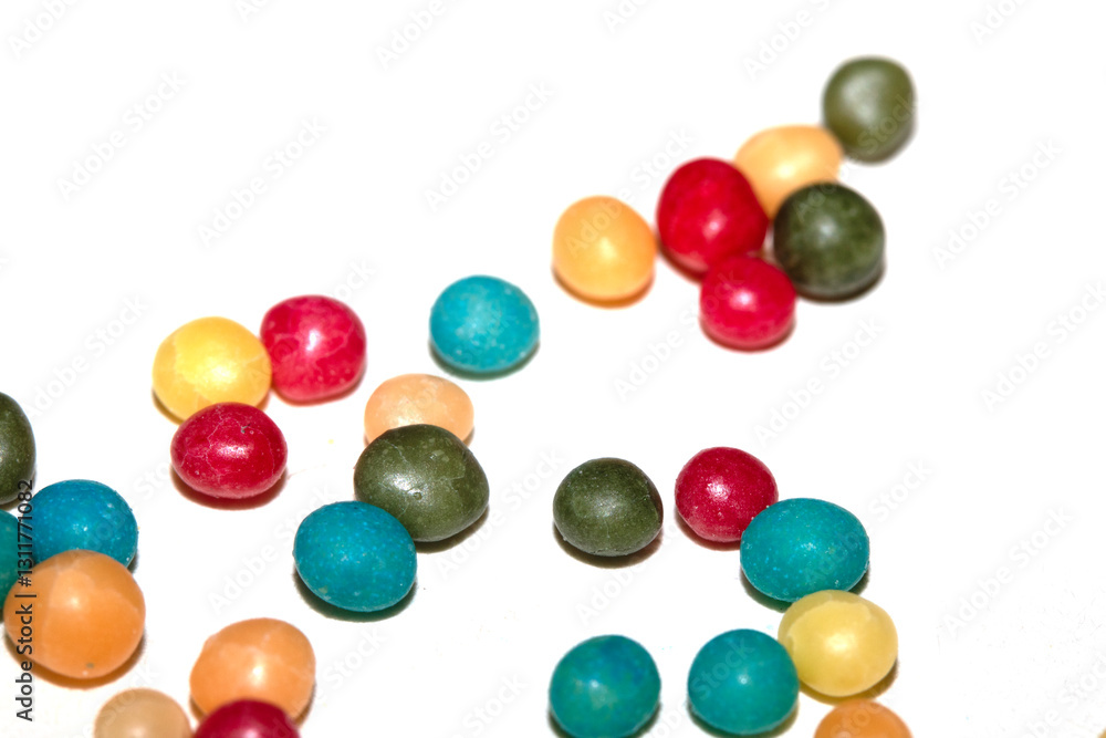 Close up of round ball sugar ice cream cake decorations on a white background Close up of round ball sugar ice cream cake decorations on a white background