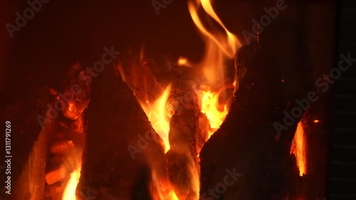 The fire burns slowly in the fireplace