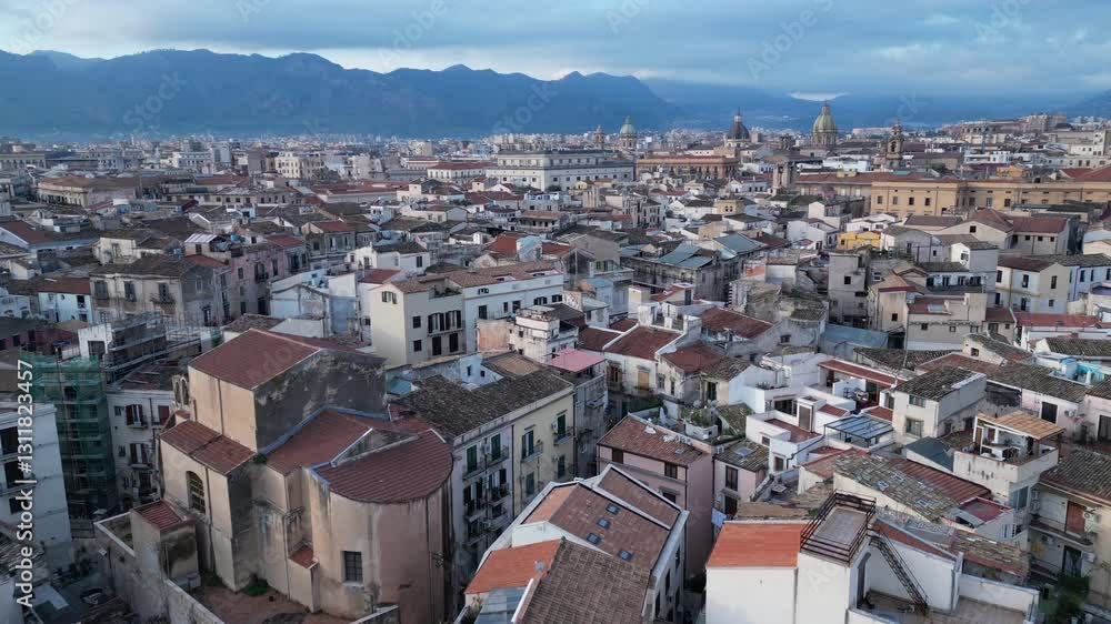 Low angle drone flight over historic buildings towards city center of Palermo, architecture and tourism in Sicily Italy
Low angle drone flight over historic buildings towards city center of Palermo, architecture and tourism in Sicily Italy