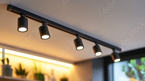 Modern track LED lighting system mounted on a white ceiling, providing bright and focused illumination in the living room