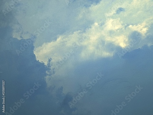 Beautiful clouds with sunlight, showcasing the natural beauty of the sky. Soft colors and gentle textures create a serene and calming image