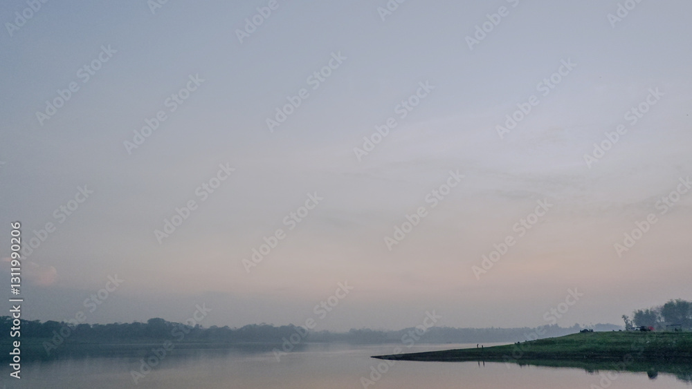 Fototapeta premium enjoying the cool morning on the river bank