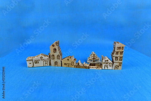 Hand carved soft spruce wood play houses and tree decorated by burning.  The houses and tree were made by me.