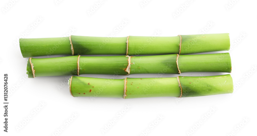 Fototapeta premium Cut green bamboo stems isolated on white, top view