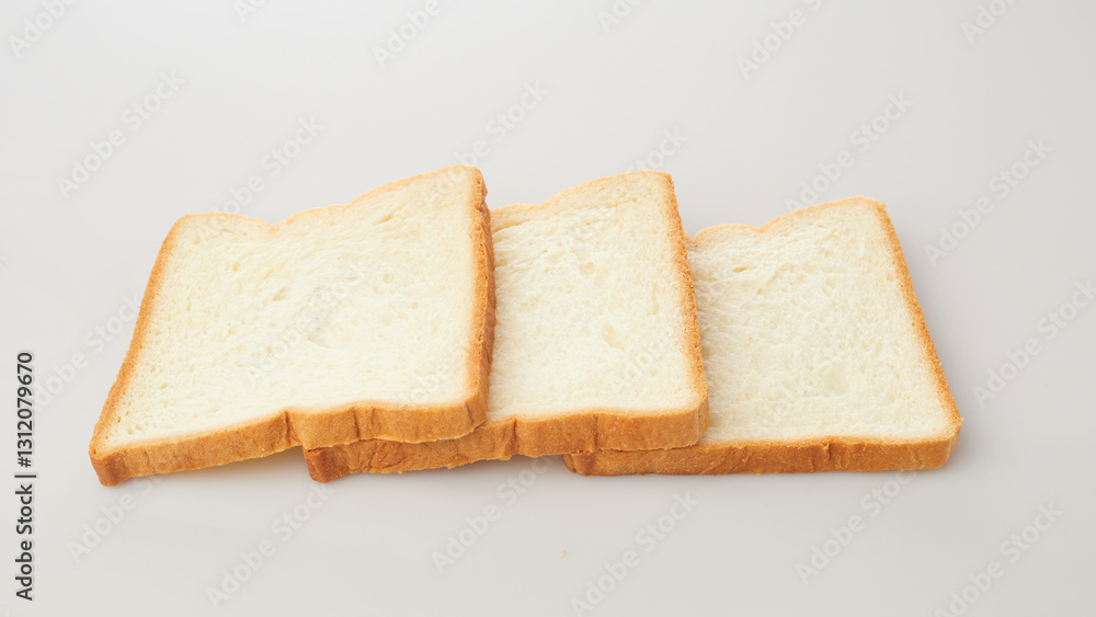 Isolated in White Background, Three Slices of Soft Bread Arranged Neatly for a Culinary Presentation Isolated in White Background, Three Slices of Soft Bread Arranged Neatly for a Culinary Presentation
