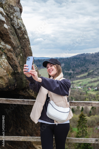 Obraz na płótnie Woman Taking Selfie in Scenic Mountain Area w salonie