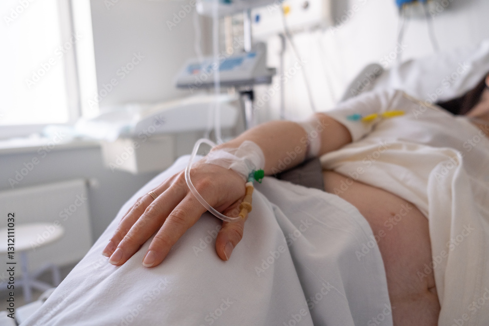 Patient in Hospital Bed with IV Drip