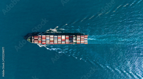 Top view Cargo Container ship with contrail in the ocean ship carrying container and running for import export concept technology freight shipping by ship.