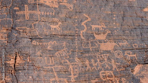 Petroglyphs, Valley of Fire State Park, Nevada. Ancient petroglyphs depicting animals, humans and symbols found on rock surface in southwestern USA