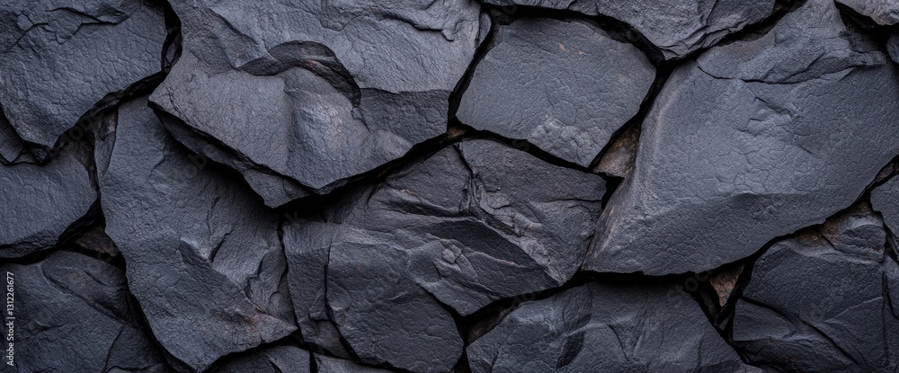 Detailed rock wall surface showcasing volcanic rock texture perfect for natural backgrounds and design elements