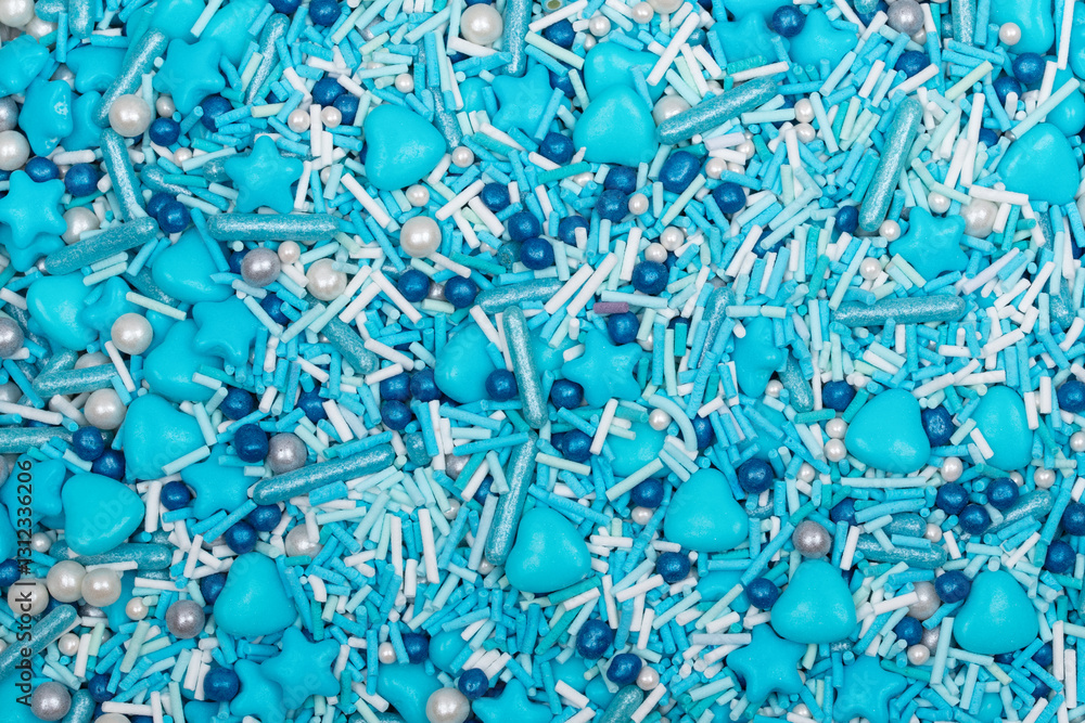 Close-up of blue heart-shaped candy with a glossy surface, forming a seamless background. Sweet confectionery texture perfect for Valentine's Day, love, and romance themes. Close-up of blue heart-shaped candy with a glossy surface, forming a seamless background. Sweet confectionery texture perfect for Valentine's Day, love, and romance themes.