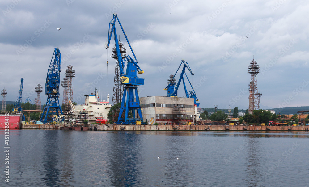 Industrial harbor scene featuring large blue cranes, Varna, Bulgaria Industrial harbor scene featuring large blue cranes, Varna, Bulgaria
