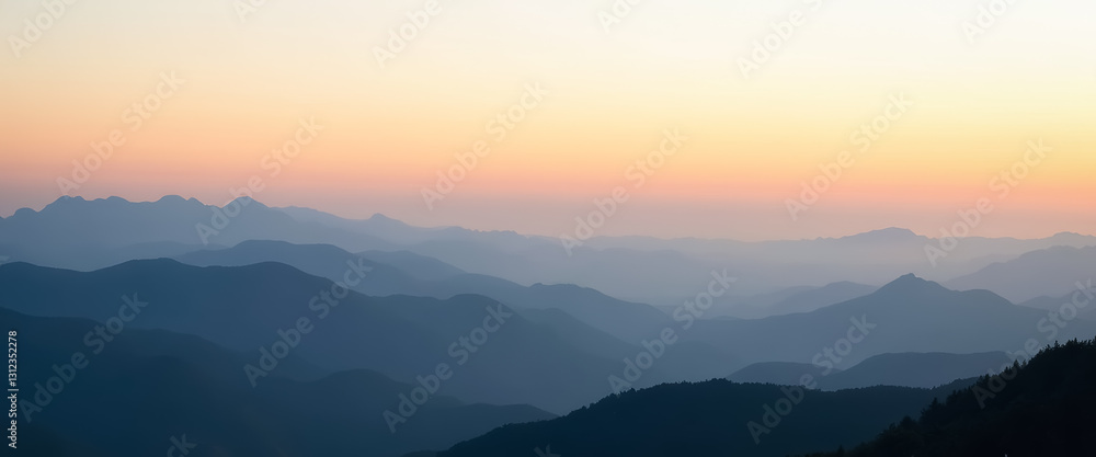 Fototapeta premium serene sunset over layered mountains