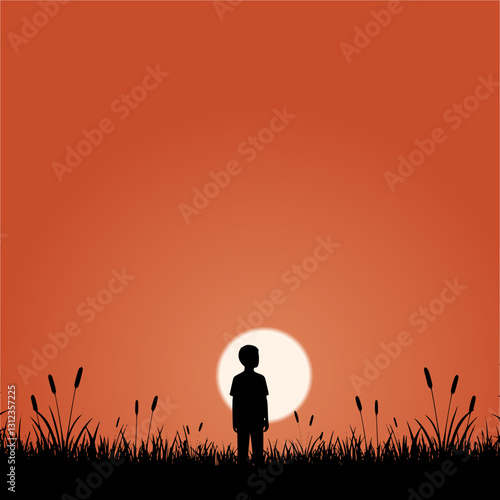 silhouette of a boy on a meadow